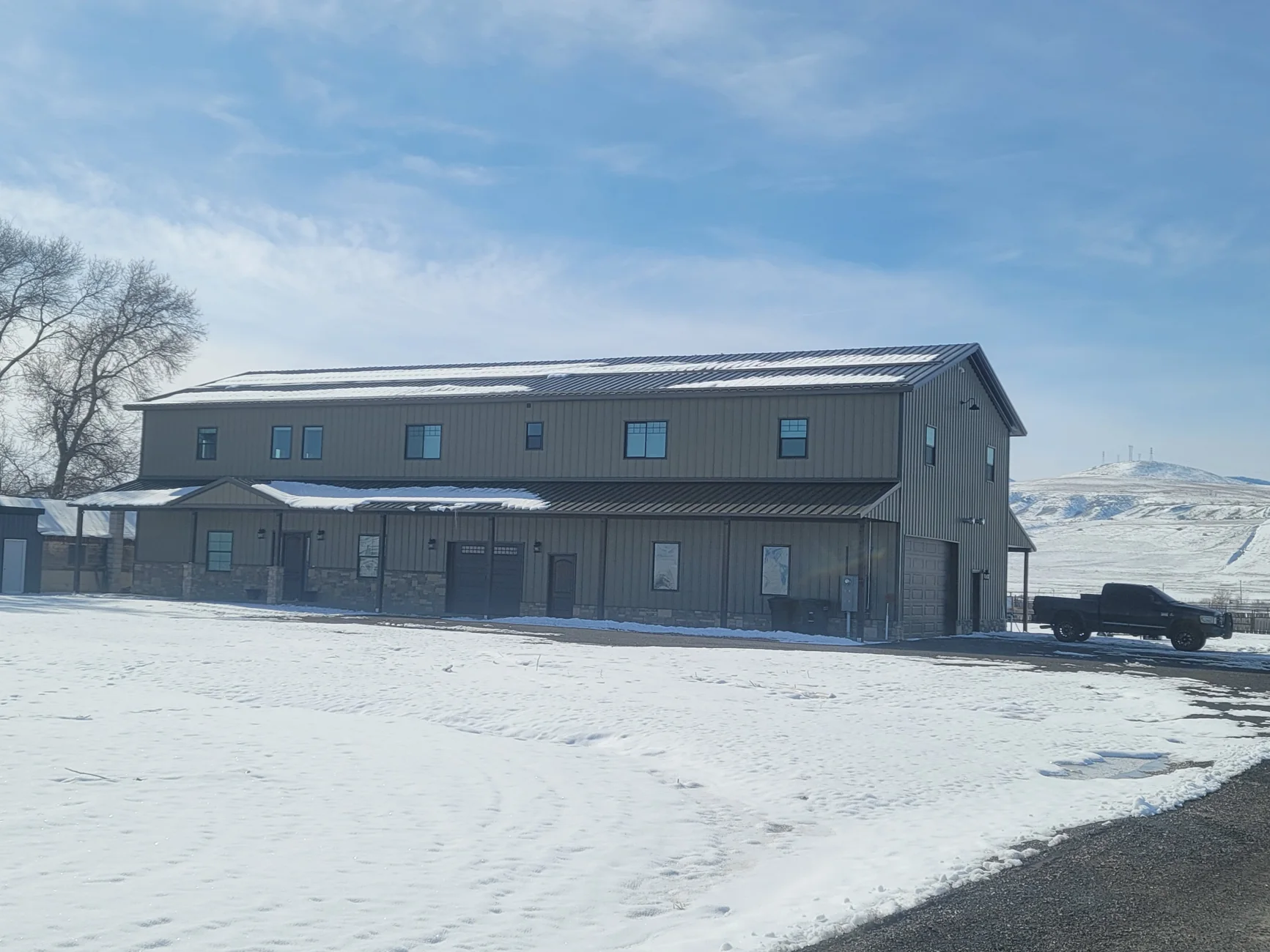 Two-story metal building exterior in winter